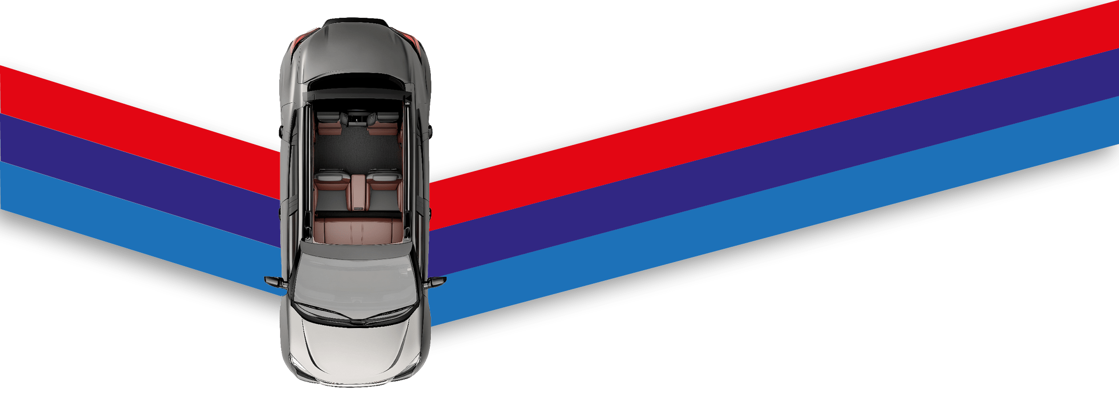 Das beige Spielzeugauto fährt aus der Vogelperspektive über einen Band in den Logo-Farben.